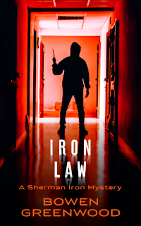 The cover of Iron Law: A menacing hooded figure with a knife.
